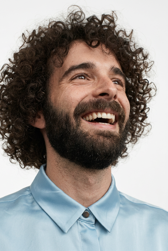 Nord Security employee laughing, wearing a light blue shirt.