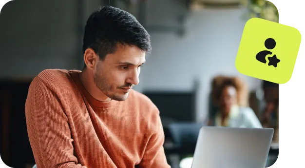 man using laptop with user profile and security icon overlay