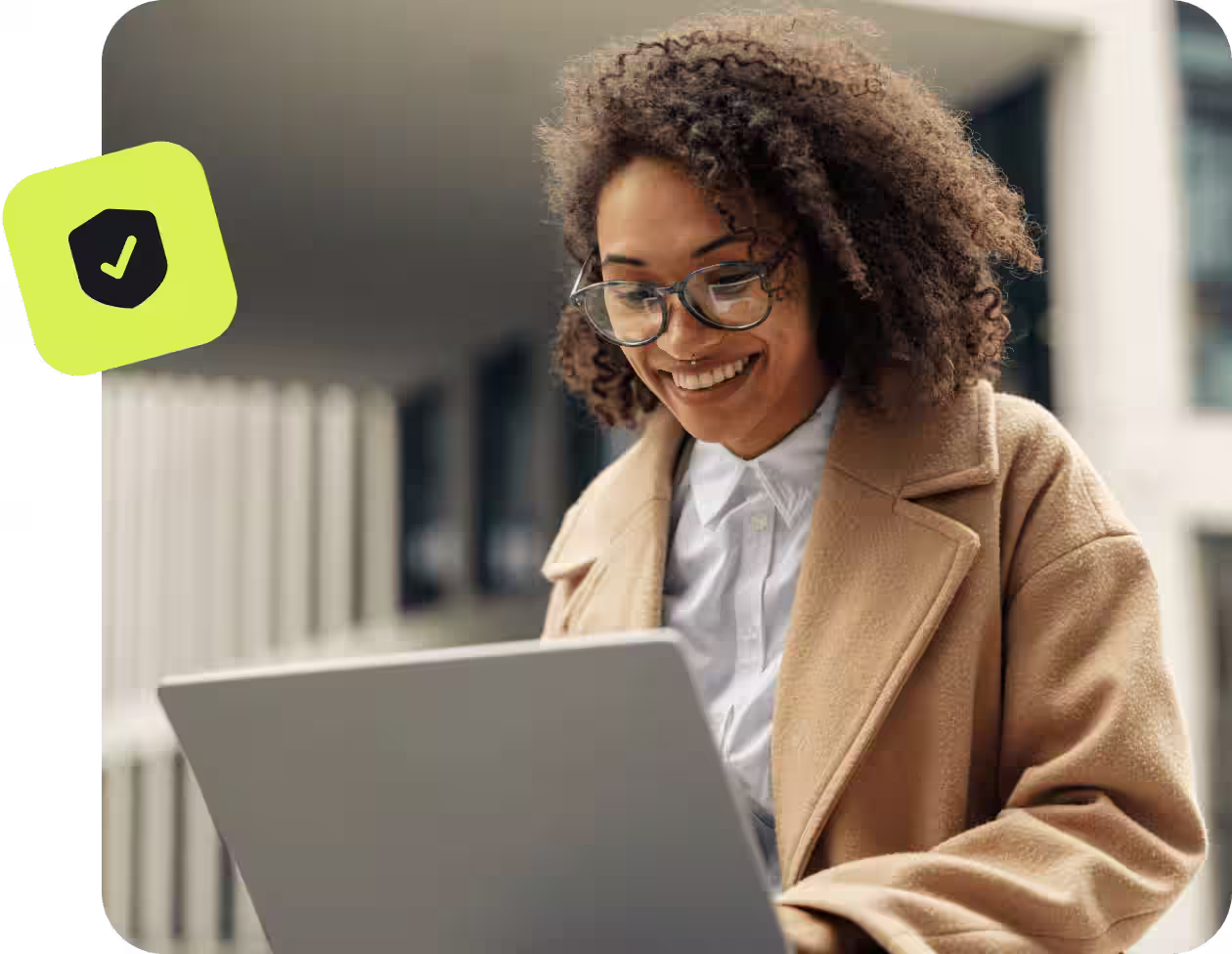 women smiling working on laptop