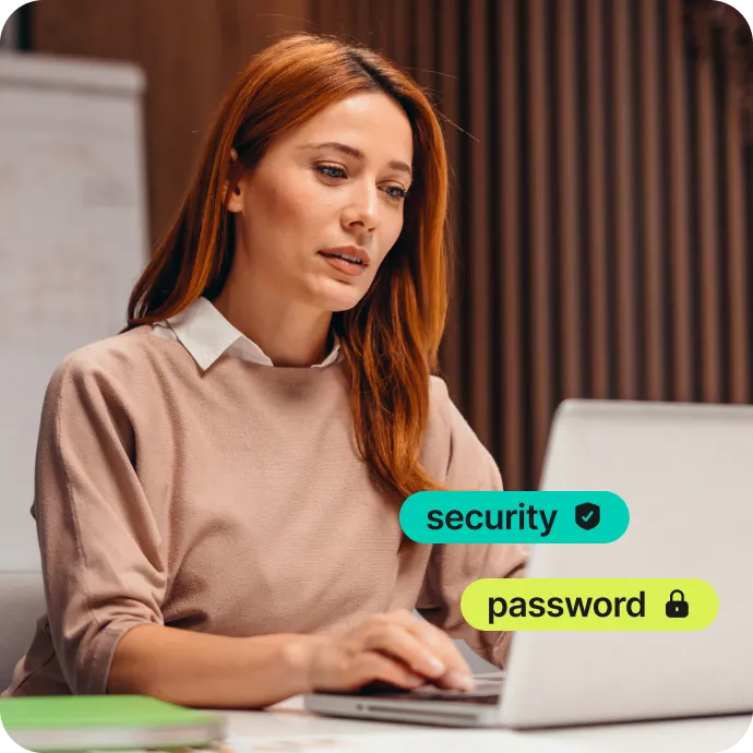 woman using laptop with security and password protection graphics overlay
