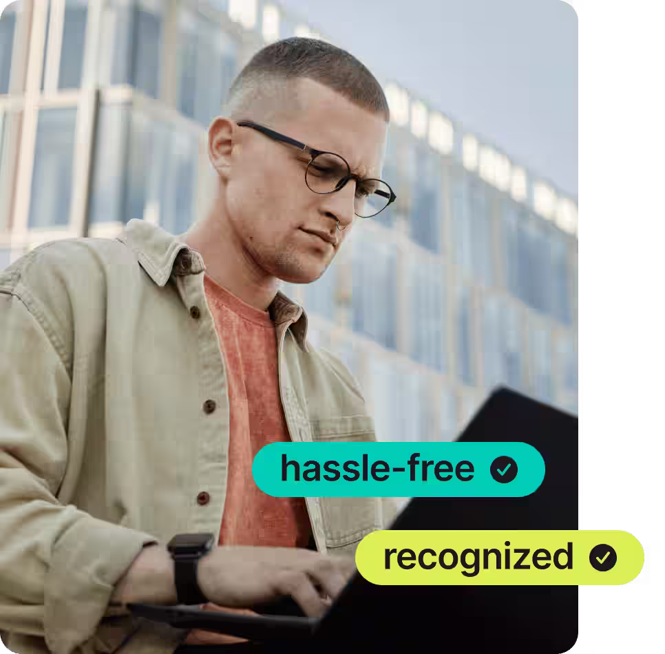 man with glasses using nordpass on his laptop