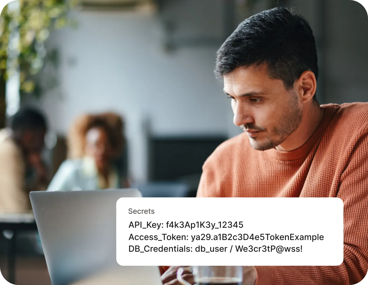 man with laptop and a note of secrets