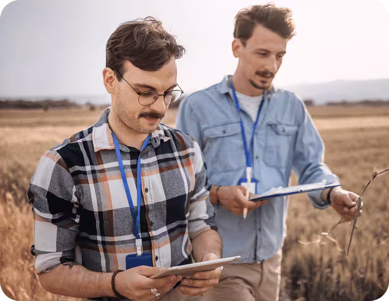 Agricultural researchers collecting outdoor data