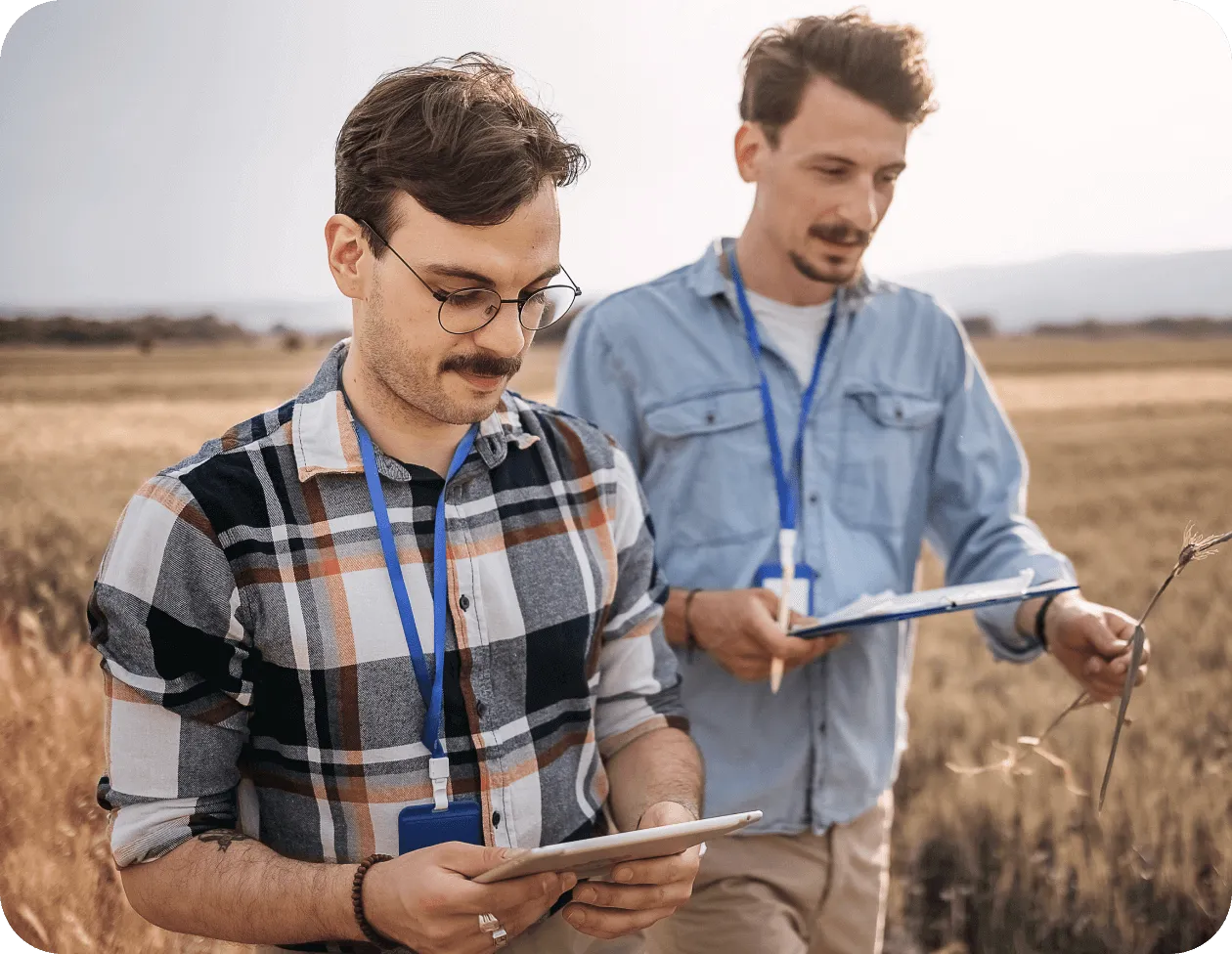 Agricultural researchers collecting outdoor data
