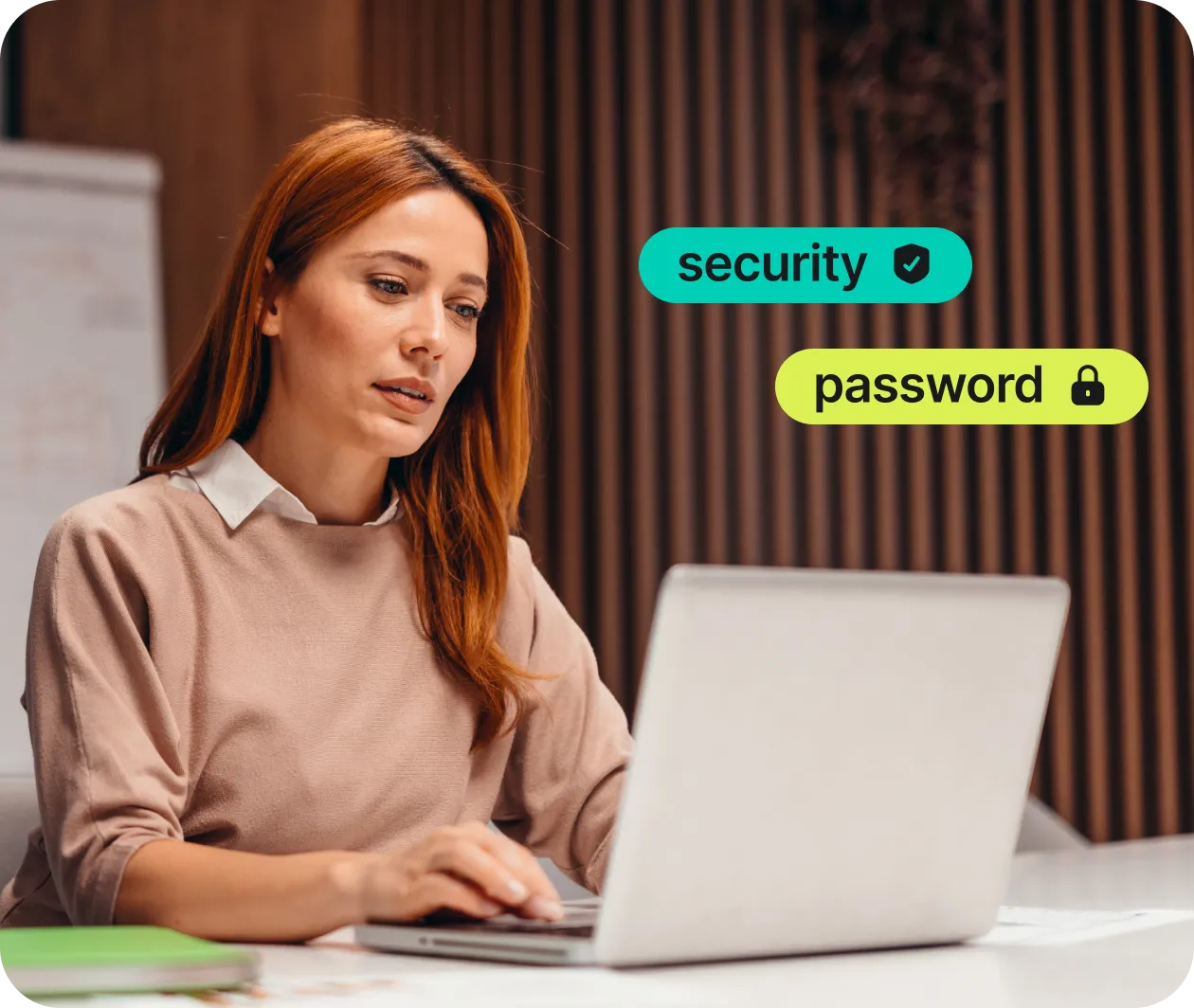 woman using laptop with security and password protection graphics overlay