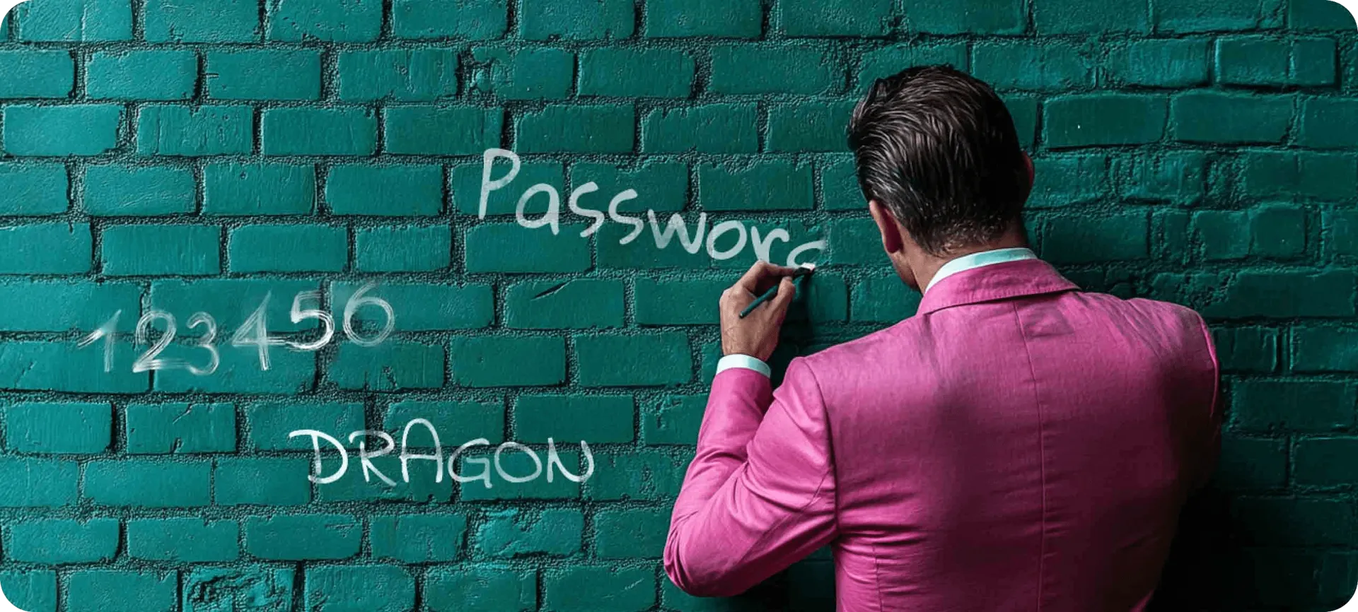 man writing passwords on the wall