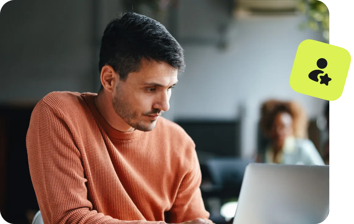 man using laptop with user profile and security icon overlay