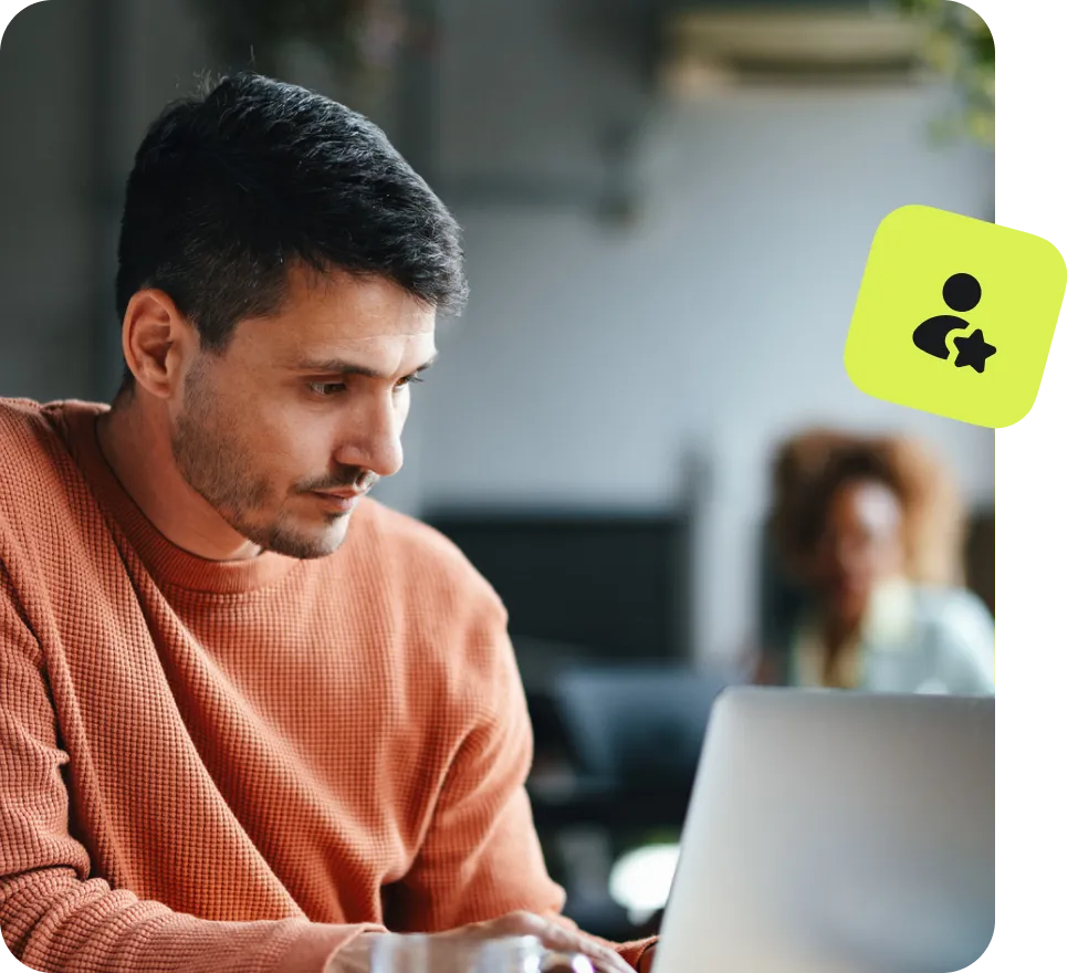 man using laptop with user profile and security icon overlay