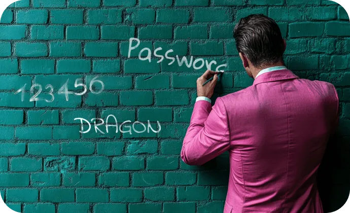 man writing passwords on the wall