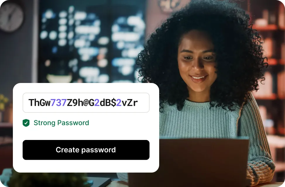 Woman smiling after creating a password and receiving confirmation it is strong.
